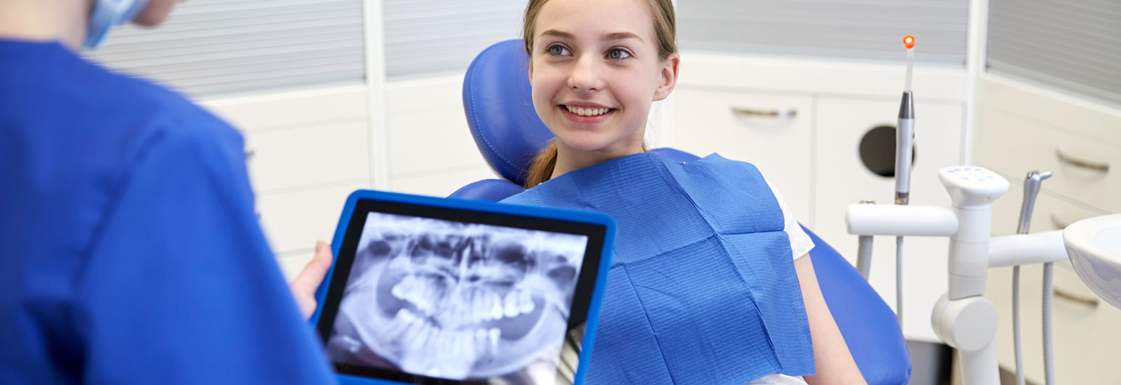 Dentist with x-ray on tablet pc